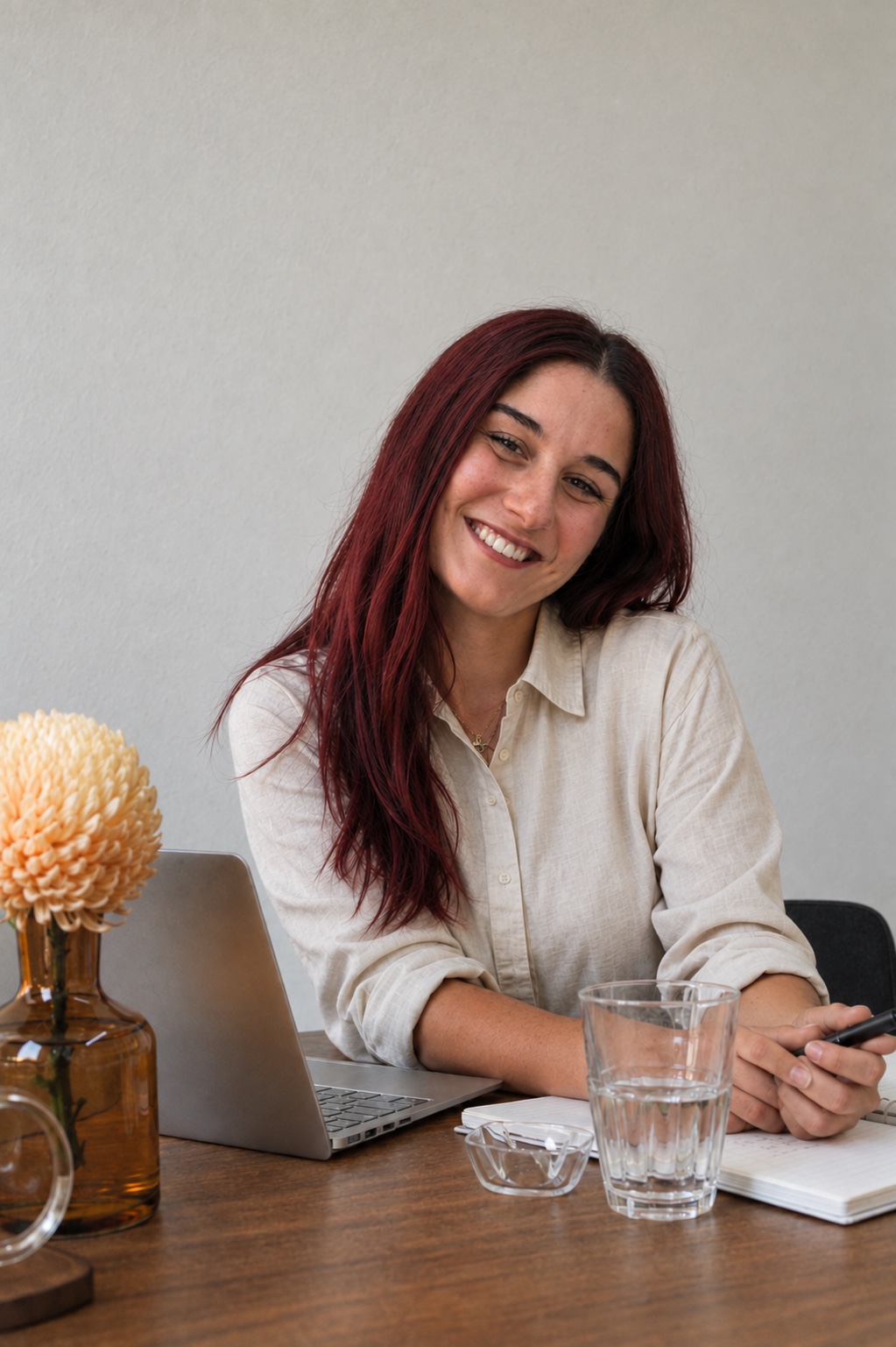 Anaïs Kougioumtzian smiling at her desk